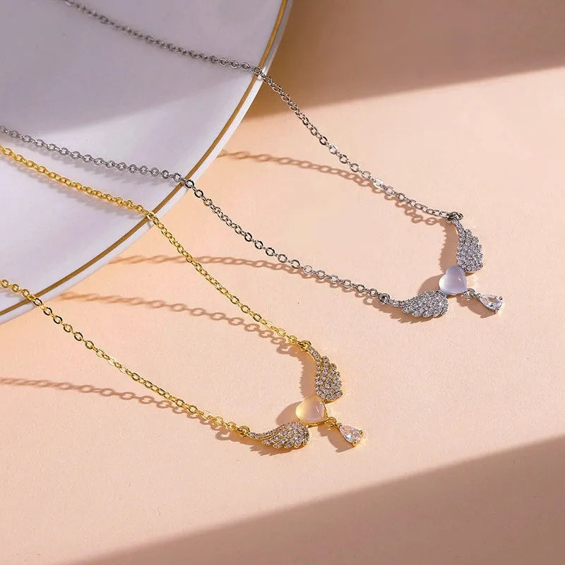 14K Gold-Plated Cat's Eye Heart Angel Wing Necklace worn to showcase its length and pendant detail