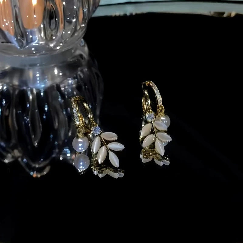 Close-up detail of the sparkling zircons and plating on the Pearl Leaf Earrings