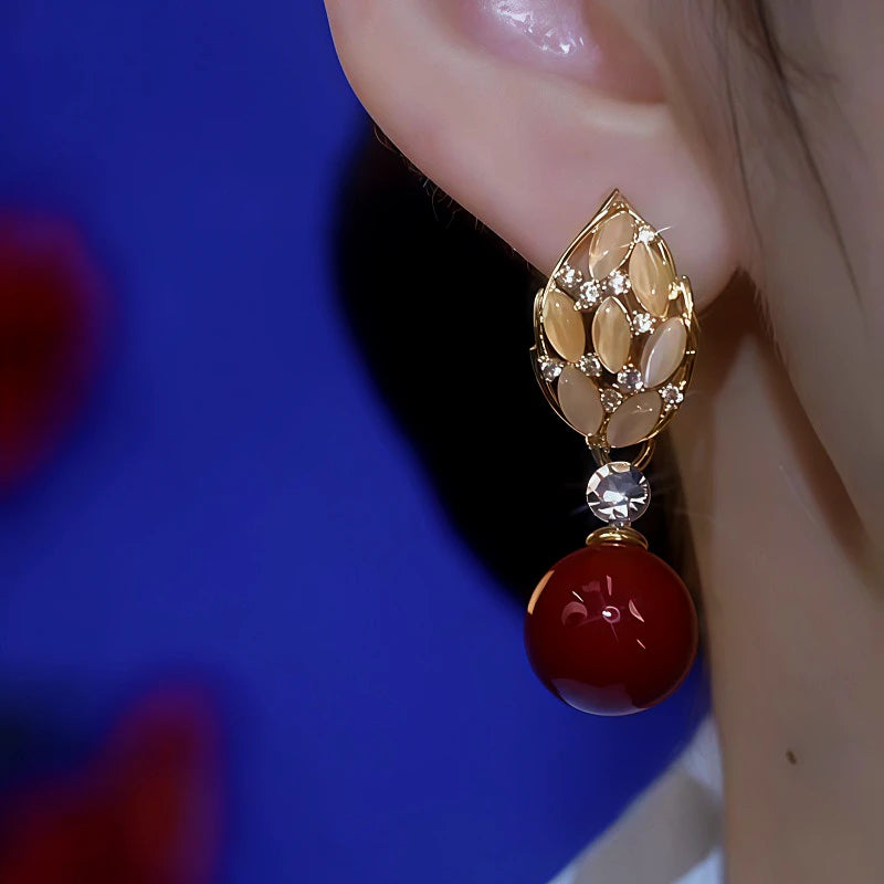 Close-up detail of the sparkling zircons and plating on the Pearl Leaf Earrings