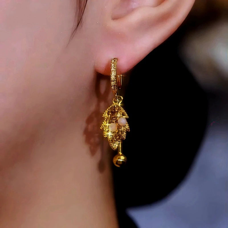 Close-up detail of the sparkling zircons and plating on the Leaf Earrings