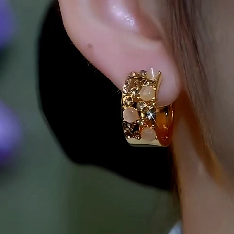 Close-up detail of the sparkling zircons and plating on the Wide Hoop Earrings