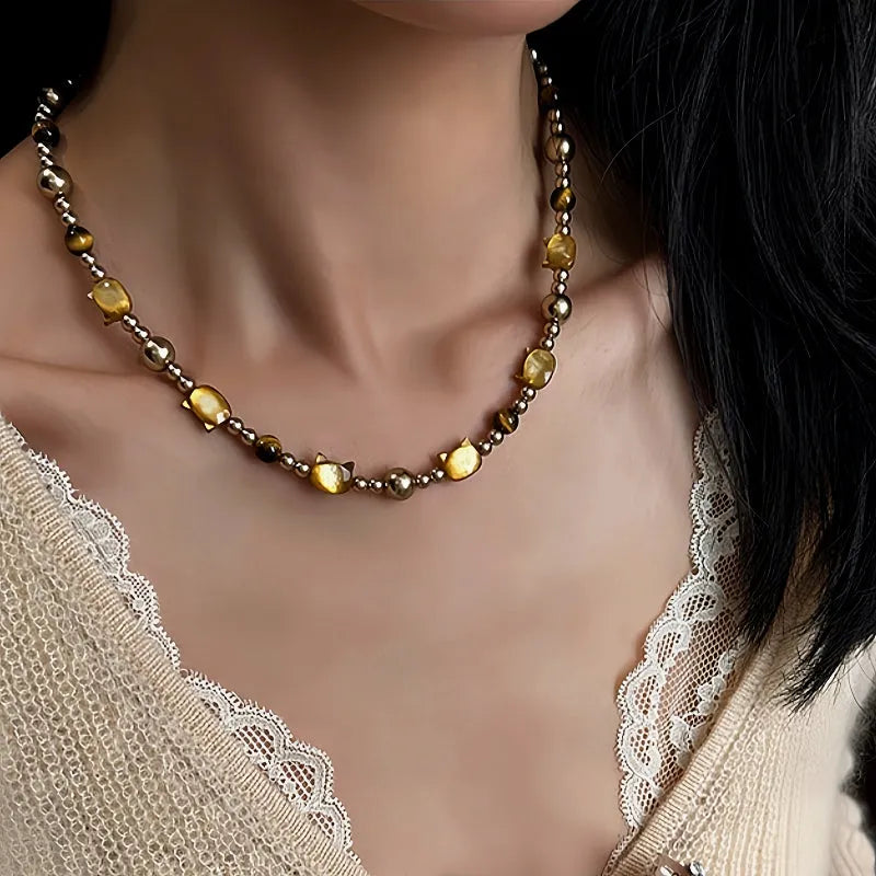Close-up of the pendant and clasp on the Cat Pearl Necklace