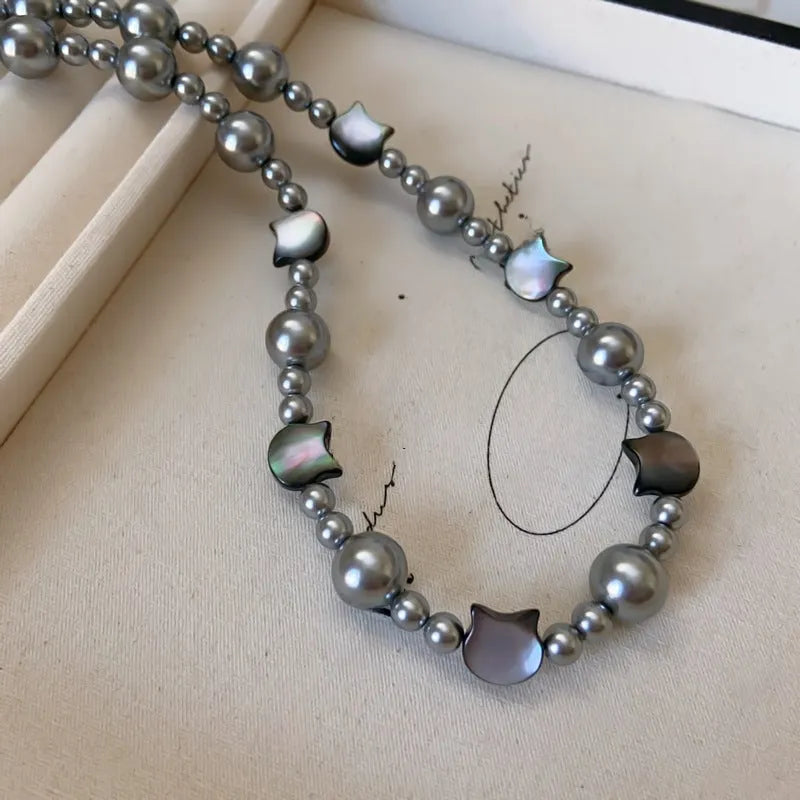 Styling the 14K Gold-Plated Cat's Eye Stone Cat Pearl Necklace with a beautiful outfit