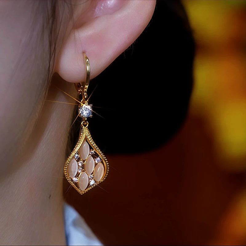 Close-up detail of the sparkling zircons and plating on the Cat's Eye Diamond Earrings