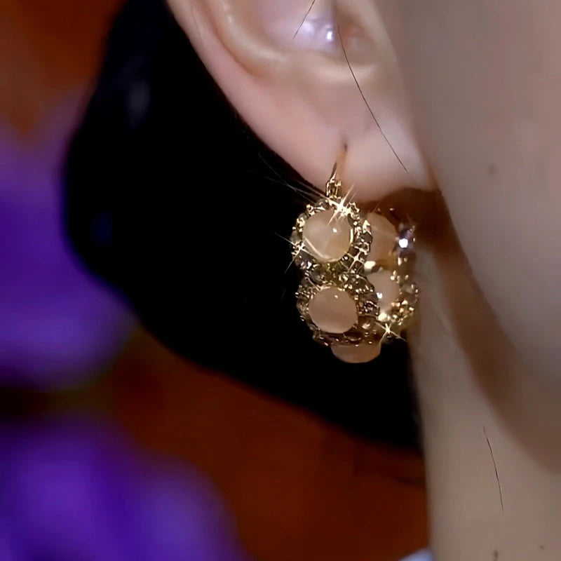 Close-up detail of the sparkling zircons and plating on the Cat's Eye Hoop Earrings