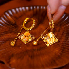 Close-up detail of the sparkling zircons and plating on the Water Drop Earrings