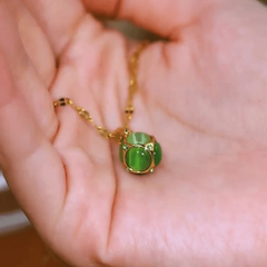 Close-up of the pendant and clasp on the Ball Necklace