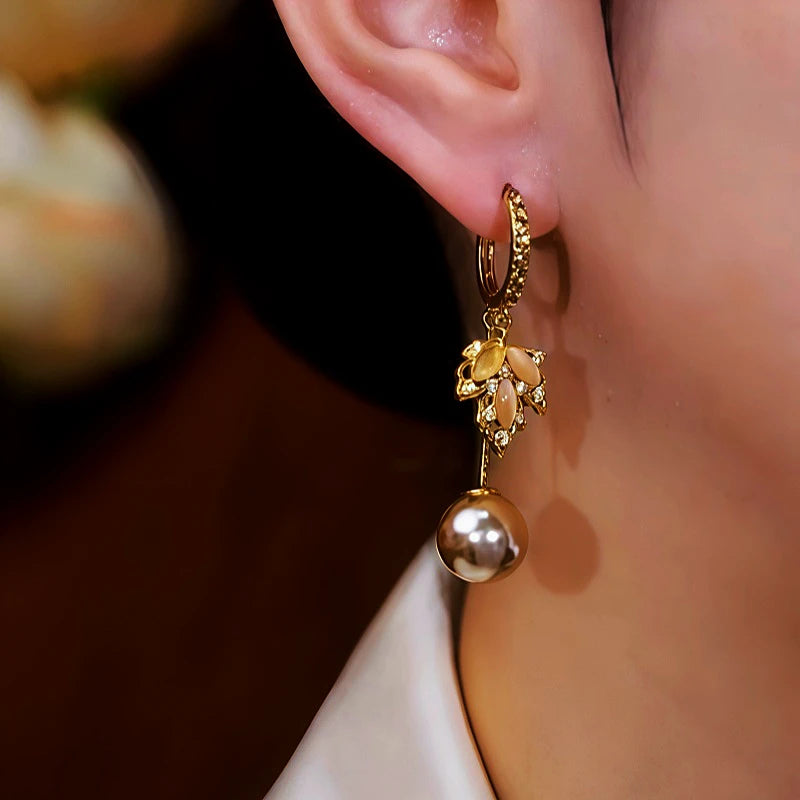 Close-up detail of the sparkling zircons and plating on the Maple Leaf Earrings