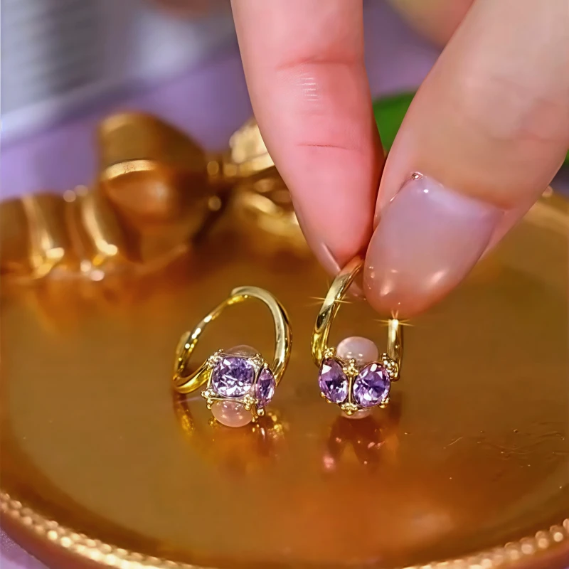 Close-up detail of the sparkling zircons and plating on the Purple Diamond Earrings