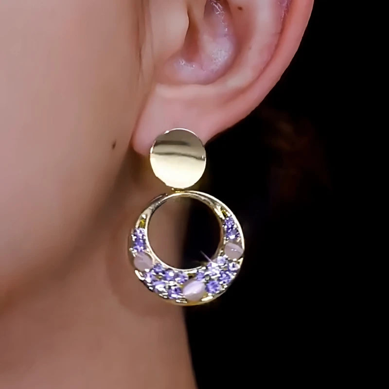 Close-up detail of the sparkling zircons and plating on the Hoop Tassel Earrings