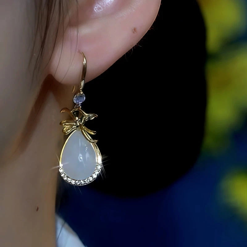 Close-up detail of the sparkling zircons and plating on the Purse Hook Earrings