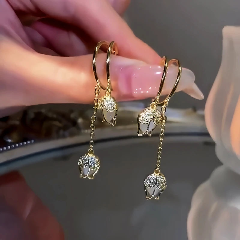 Angled view of the 14K Gold-Plated Cat's Eye Stone Tulip Earrings