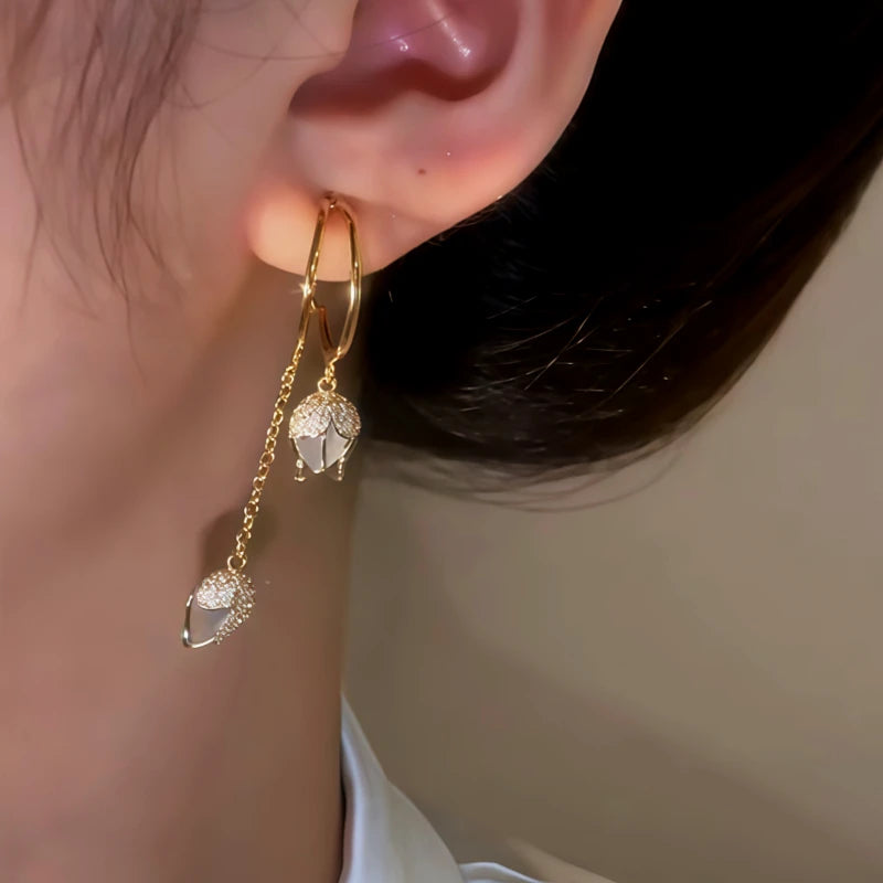 Close-up detail of the sparkling zircons and plating on the Tulip Earrings