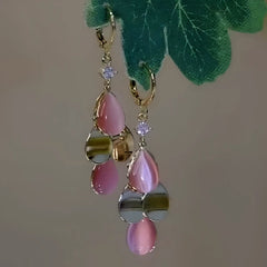 Angled view of the 14K Gold-Plated Cat's Eye Stone Water Drop Earrings