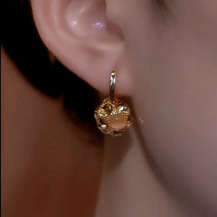 Close-up detail of the sparkling zircons and plating on the Diamond Ball Earrings