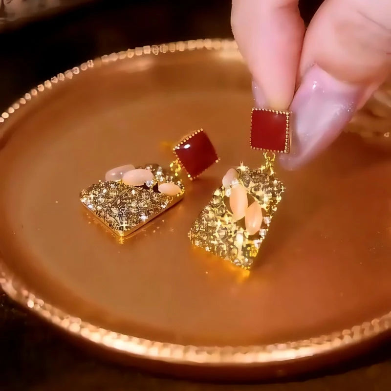 Close-up detail of the sparkling zircons and plating on the Diamond Cube Earrings