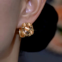 Close-up detail of the sparkling zircons and plating on the Double-Sided Earrings