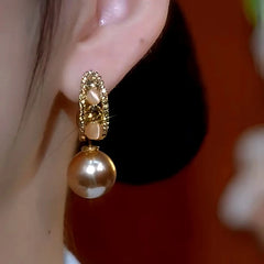 Close-up detail of the sparkling zircons and plating on the Diamond Pearl Earrings