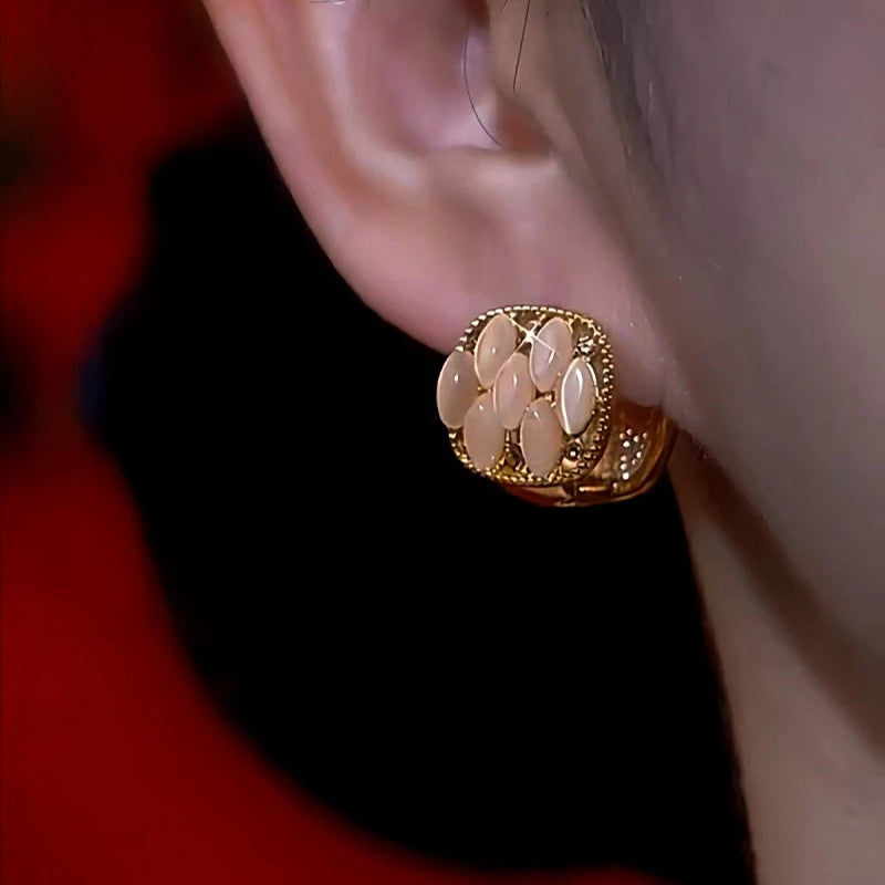Close-up detail of the sparkling zircons and plating on the Red Drop Earrings