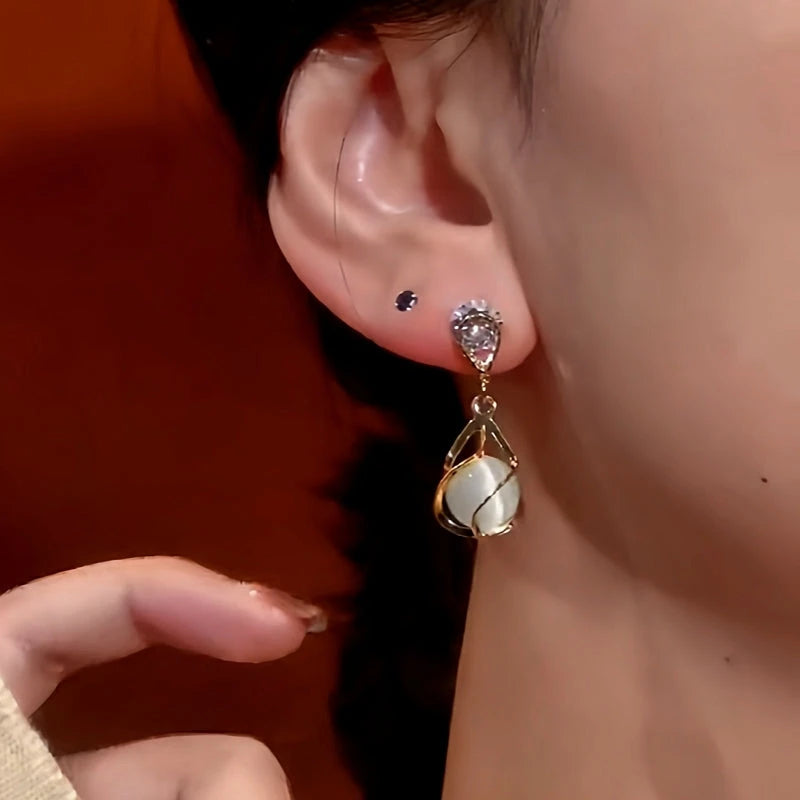 Close-up detail of the sparkling zircons and plating on the Zircon Cat's Eye Earrings