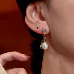 Close-up detail of the sparkling zircons and plating on the Zircon Cat's Eye Earrings