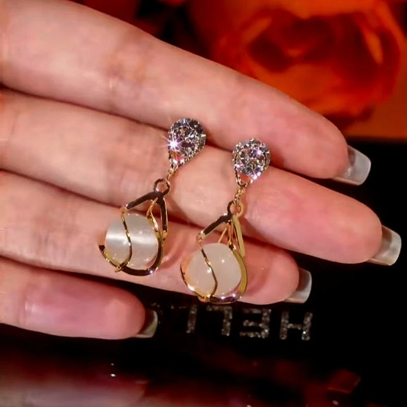 Angled view of the 14K Gold-Plated Cat's Eye Zircon Earrings