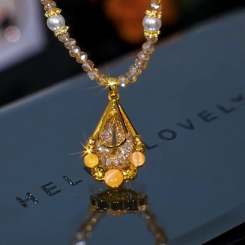 Detailed view of the 14K Gold-Plated Champagne Crystal Mesh Water Drop Necklace chain and pendant
