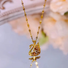 Detailed view of the 14K Gold-Plated Champagne Diamond Swan Pendant Necklace chain and pendant