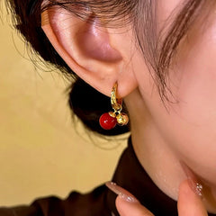 Close-up detail of the sparkling zircons and plating on the Cherry Bead Earrings