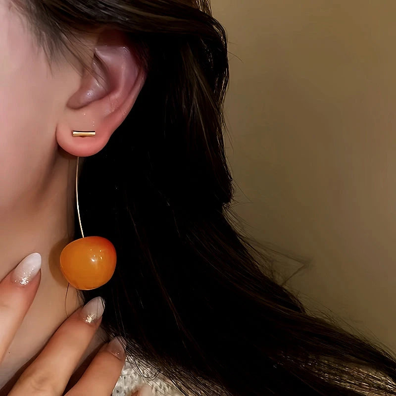 Close-up detail of the sparkling zircons and plating on the Golden Cherry Earrings