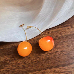 Angled view of the 14K Gold-Plated Cherry Earrings