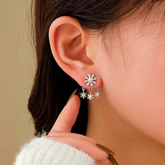 Angled view of the 14K Gold-Plated Chiristmas Snowflake Jacket Earrings