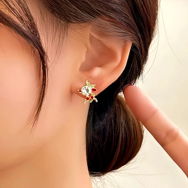 Angled view of the 14K Gold-Plated Christmas Asymmetrical Deer Earrings