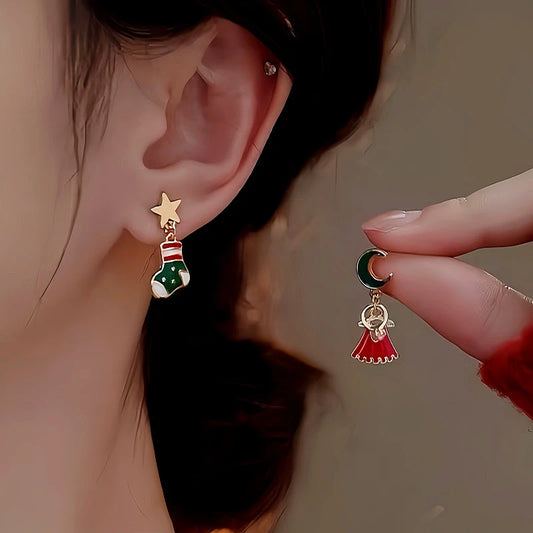 Model showcasing the dangle and style of the 14K Gold-Plated Christmas Asymmetrical Star Mmoon Earrings