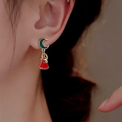 Angled view of the 14K Gold-Plated Christmas Asymmetrical Star Mmoon Earrings