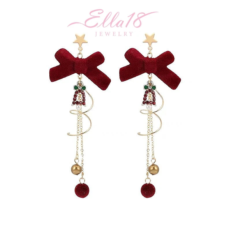 Angled view of the 14K Gold-Plated Christmas Bow Tassel Earrings