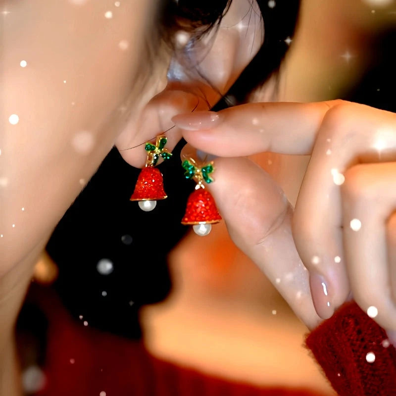 Model showcasing the dangle and style of the 14K Gold-Plated Christmas Bow Wind Chime Earrings