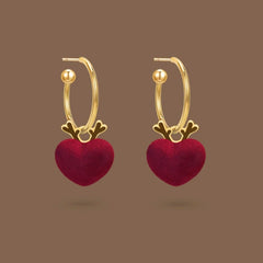 Model showcasing the dangle and style of the 14K Gold-Plated Christmas Deer Heart Earrings