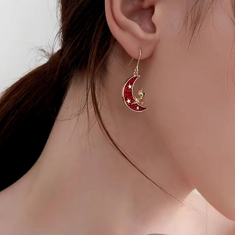 Model showcasing the dangle and style of the 14K Gold-Plated Christmas Deer Moon Ear Hook Earrings