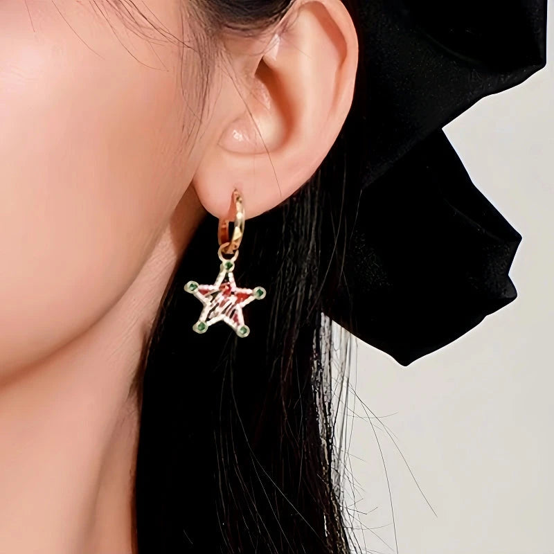 Model showcasing the dangle and style of the 14K Gold-Plated Christmas Diamond-Encrusted Colorful Five-Pointed Star Earrings