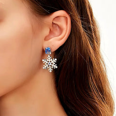 Model showcasing the dangle and style of the 14K Gold-Plated Christmas Diamond-Studded Ice And Snow Zircon Earrings