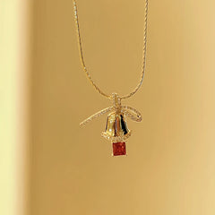 Angled view of the 14K Gold-Plated Christmas Diamond Bow Jingle Bell Series Earrings And Necklace