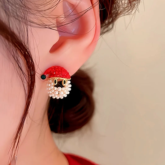 Model showcasing the dangle and style of the 14K Gold-Plated Christmas Diamond Santa Claus Hat Earrings