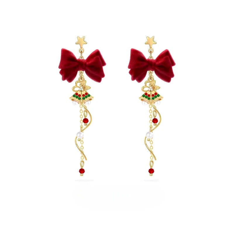 Model showcasing the dangle and style of the 14K Gold-Plated Christmas Gift Bell Earrings