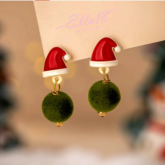 Model showcasing the dangle and style of the 14K Gold-Plated Christmas Hat Plush Ball Earrings