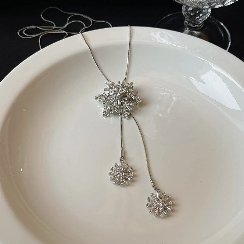 14K Gold-Plated Christmas Rotating Zircon Snowflake Sweater Chain Necklace worn to showcase its length and pendant detail