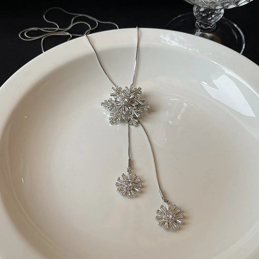 14K Gold-Plated Christmas Rotating Zircon Snowflake Sweater Chain Necklace worn to showcase its length and pendant detail