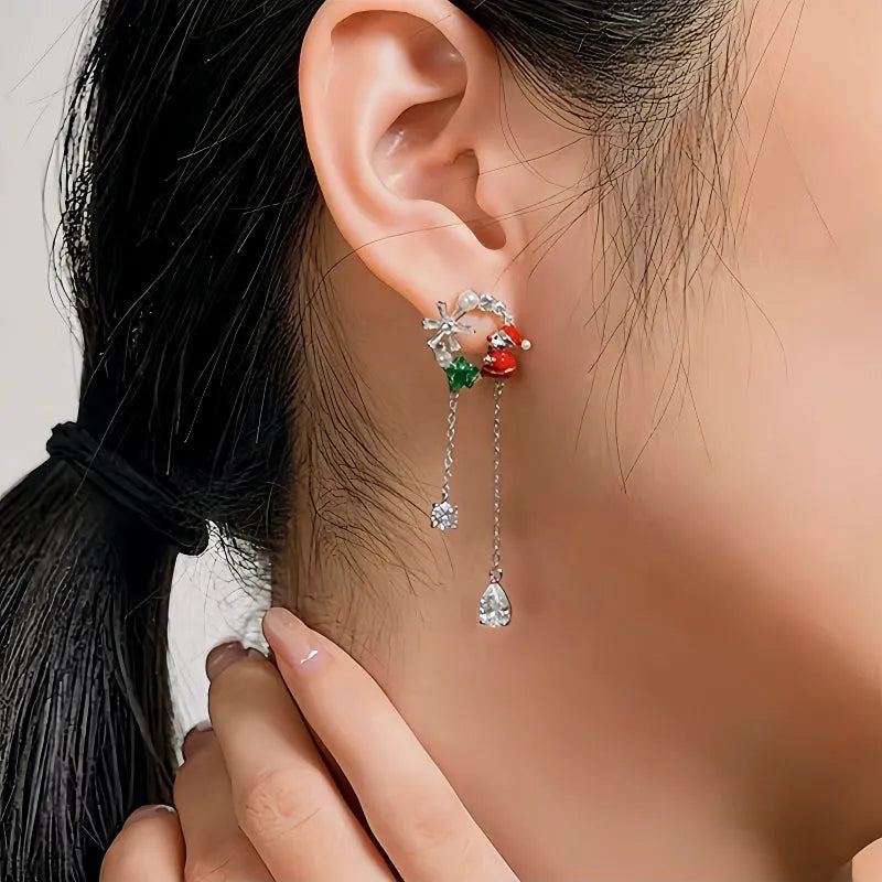 Model showcasing the dangle and style of the 14K Gold-Plated Christmas Santa Claus Snowflake Tassel Earrings