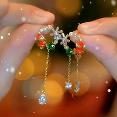 Close-up detail of the sparkling zircons and plating on the Santa Tassel Earrings