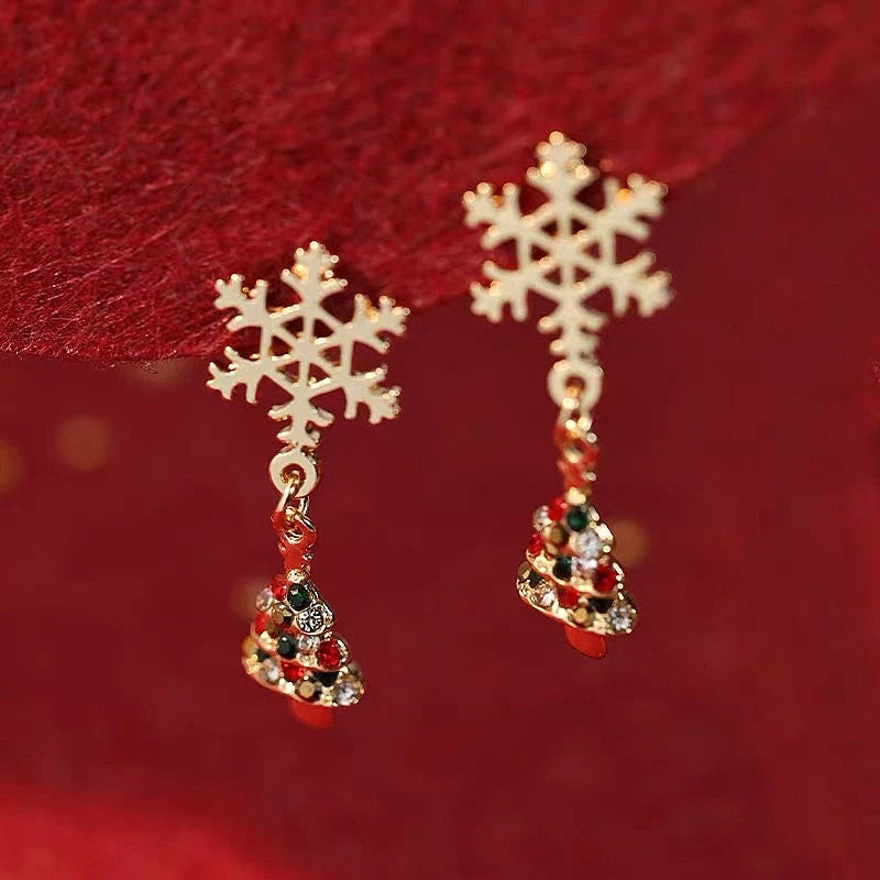 Angled view of the 14K Gold-Plated Christmas Snowflake Christmas Tree Earrings